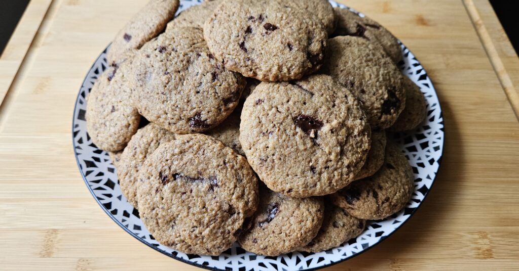 mountain of chocolate chip cookies on a plate